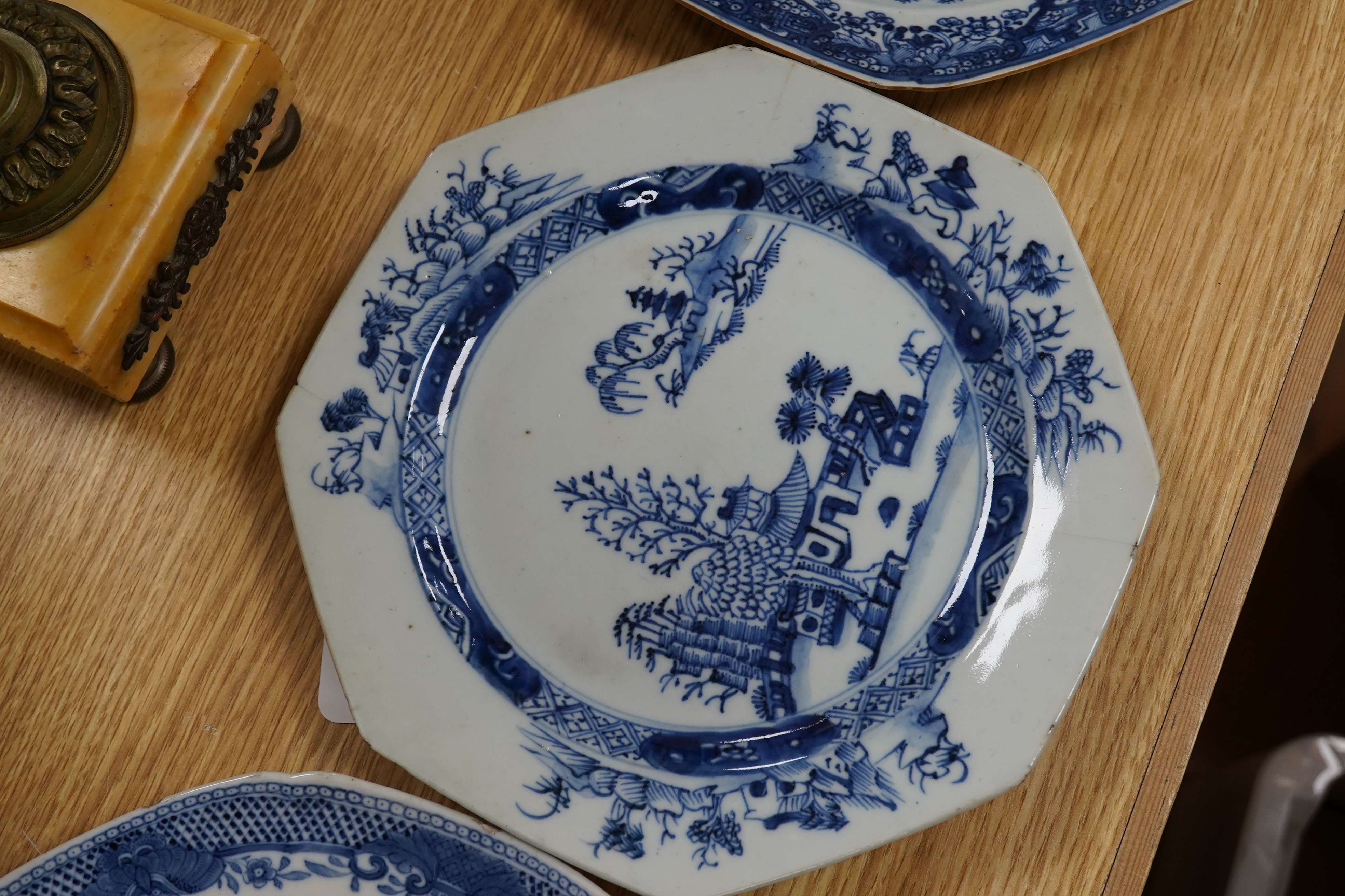 Five 18th century Chinese Export blue and white plates, largest 24cm diameter. Condition - all have varying amounts of damage